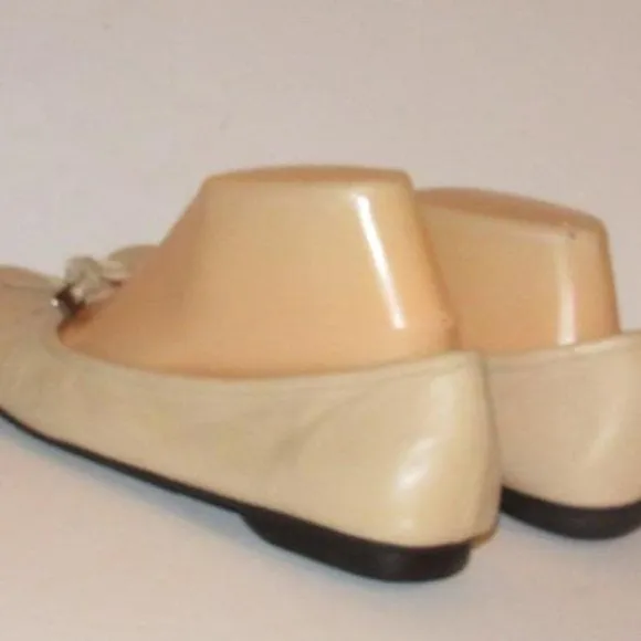 Prada Pink Beige Leather Ballet Flats with an Almond Toe and Bow with Chrome Accents