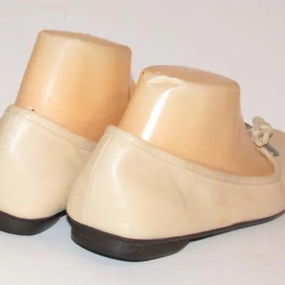 Prada Pink Beige Leather Ballet Flats with an Almond Toe and Bow with Chrome Accents